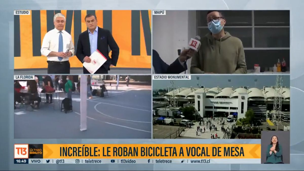 La imagen muestra el momento en que T13 daba cuenta cómo a un vocal de mesa en Maipú le robaron su bicicleta, la cual había dejado en la entrada de su local de votación.